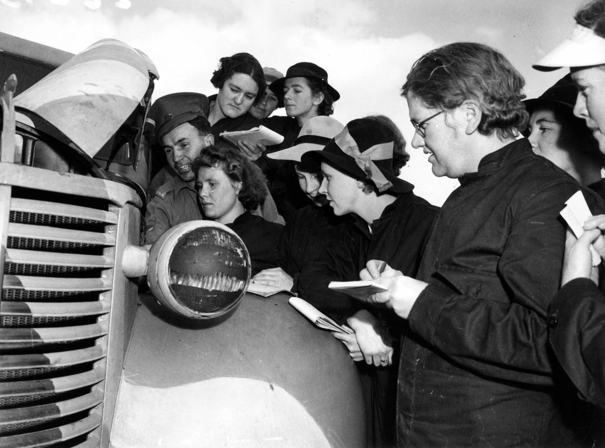 Australian Women's Army Serice members learning about vehicle maintenance, July 1942