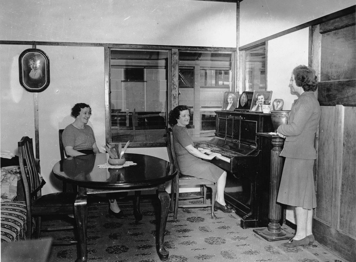 Three women in a Rocklea war workers' house, Brisbane, 1944