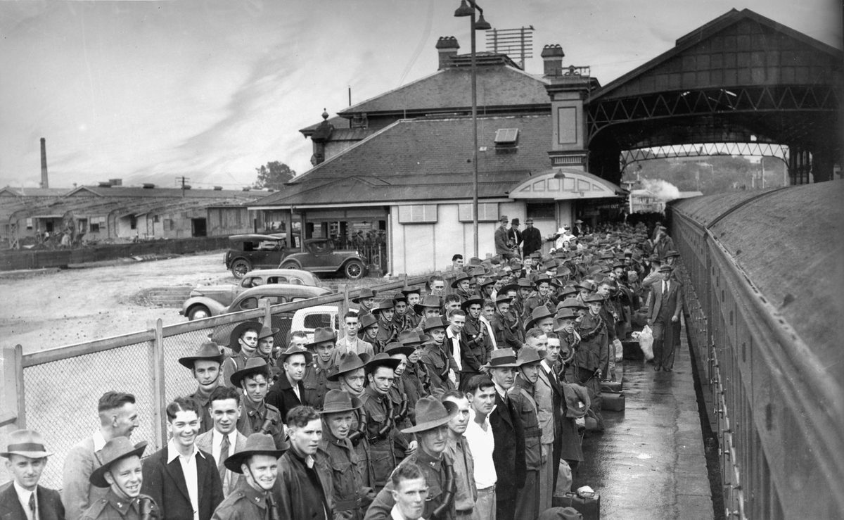 Trainee soldiers at Roma Street Station, Brisbane, waiting to embark on a train to Caloundra Camp during World War II, 1940