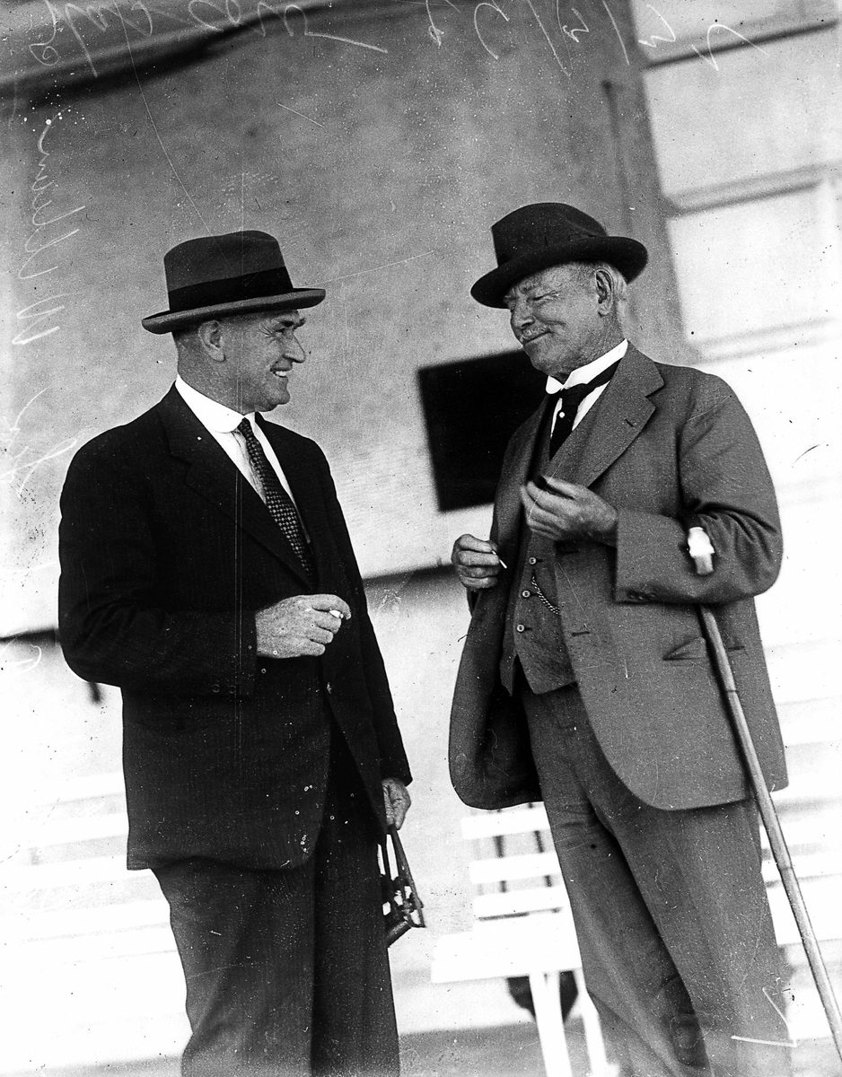 Sharing a laugh are Sir William Glasgow and Jas Clark at the Eagle Farm Racetrack, Brisbane, 26 March 1932
