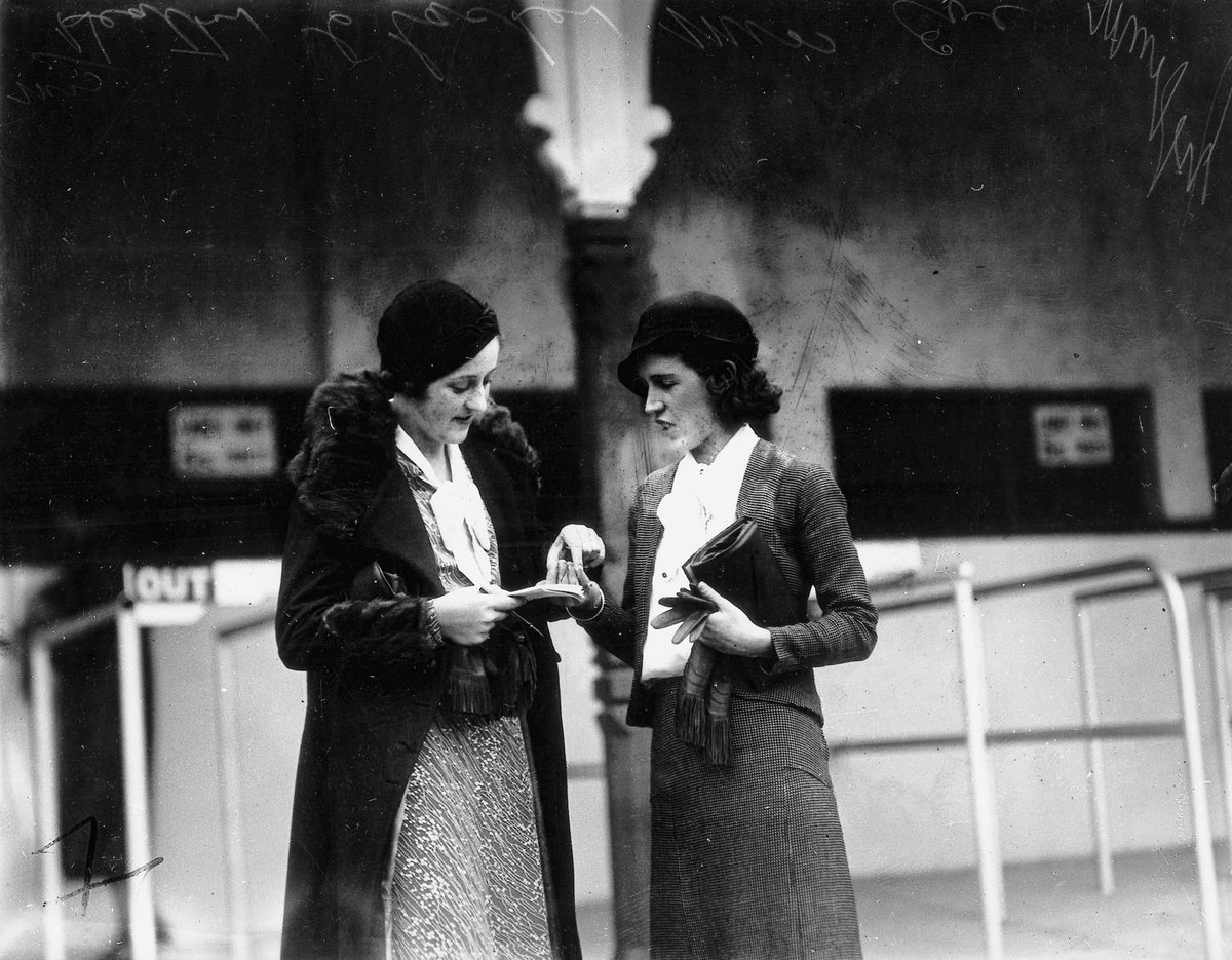 Miss Heather Clacher and Miss Eve Murphy split their winnings at the Ascot races, Brisbane, June 1933