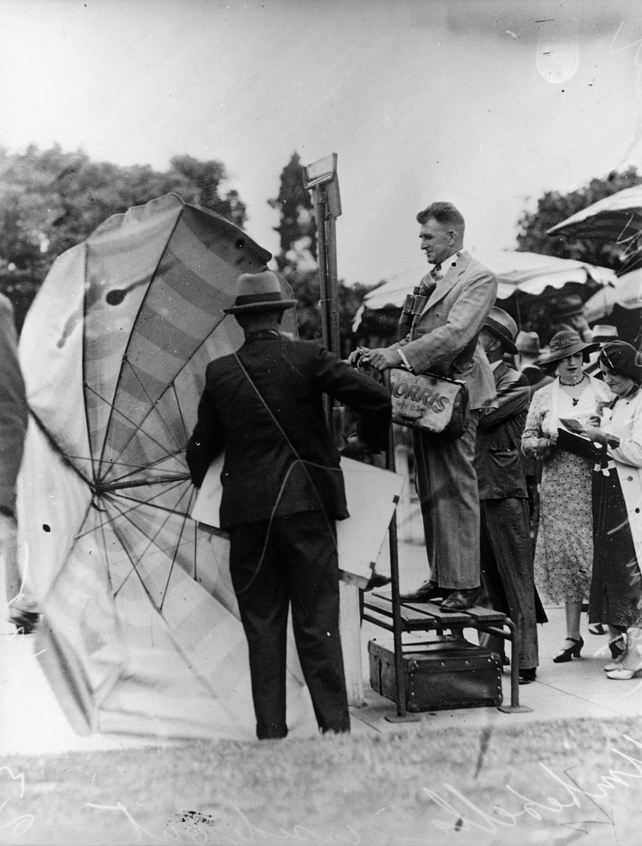 Brisbane bookmaker Frank Morris setting up in the betting ring, February 1935