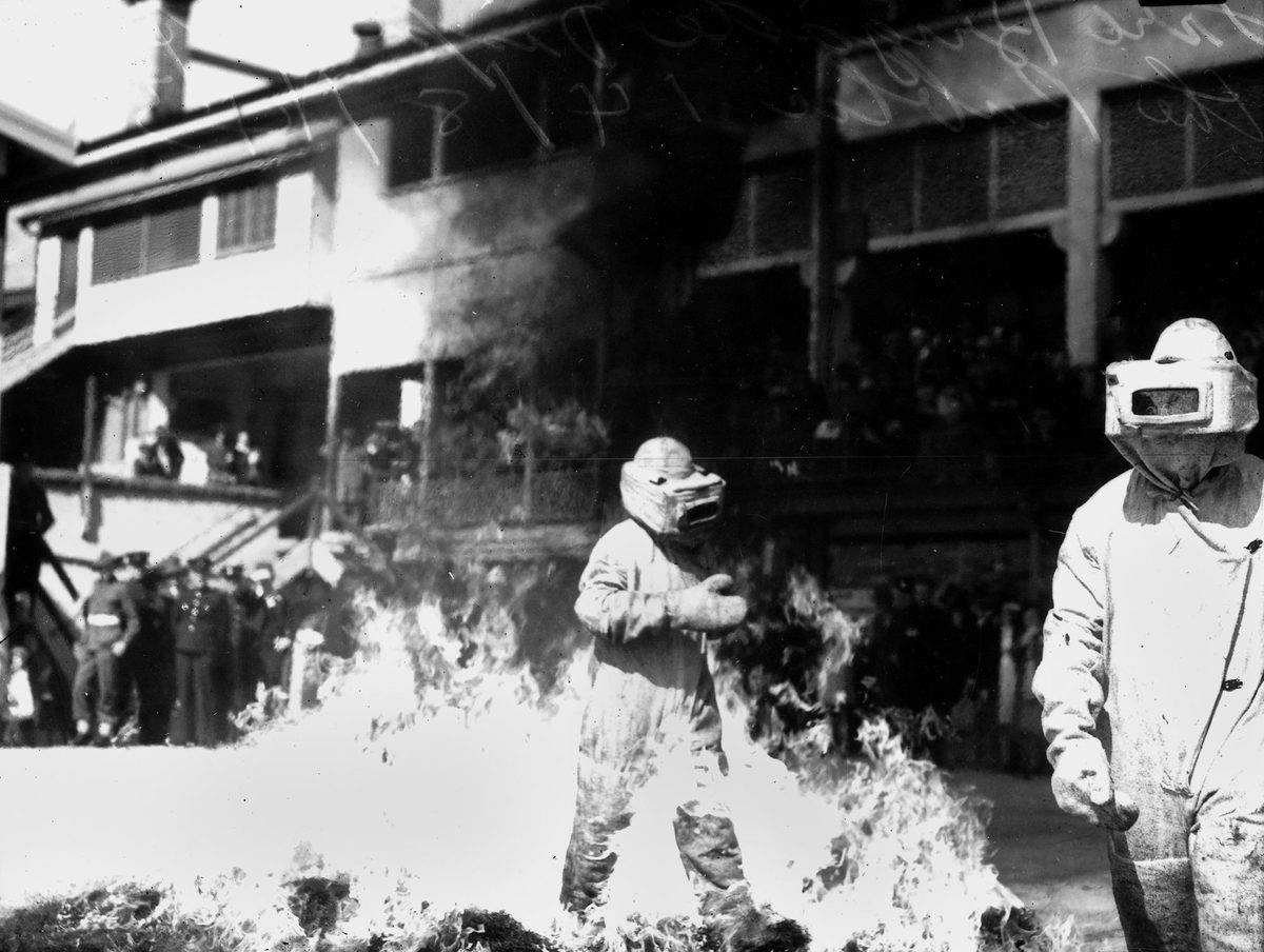 Brisbane fire brigade demonstrating flame-resistant suits, 1943