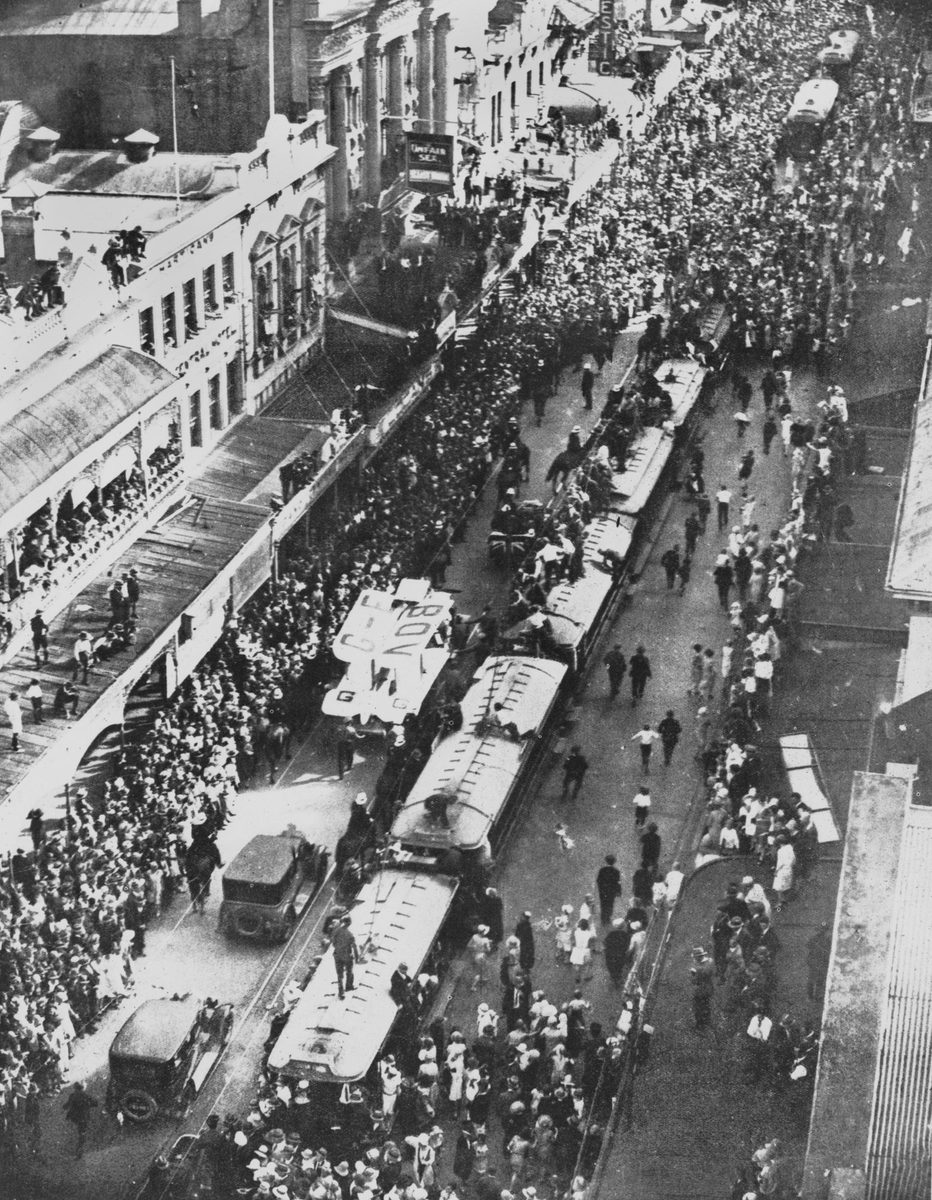 Procession for Bert Hinkler and his plane in Queen Street, Brisbane, 1928