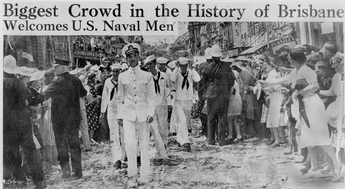 Crowds cheering American sailors marching through Brisbane as part of a goodwill visit, 1941