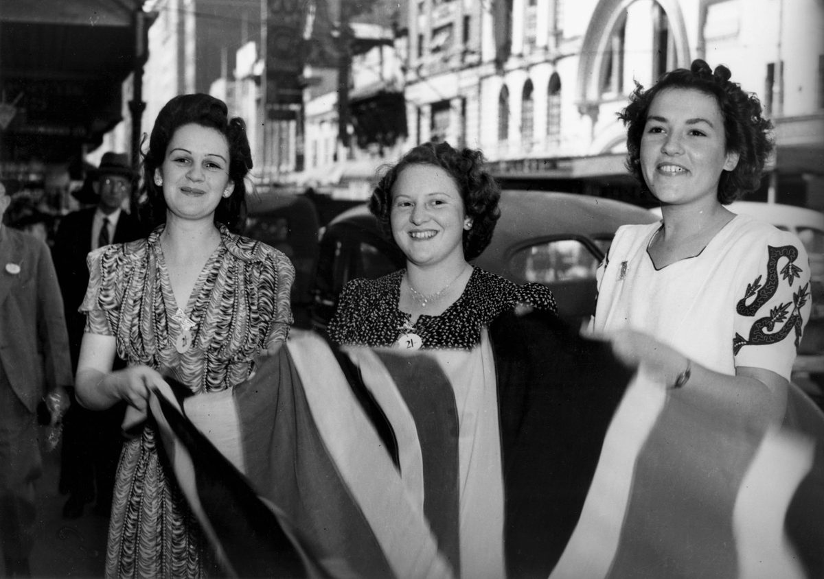 Smiling girls collecting donations for Battle Stations Week, Brisbane, 1942