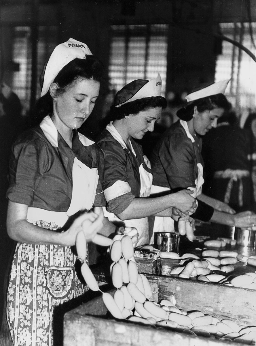 Tasmin Boyd and her fellow workers on the production line at a food packing factory, Brisbane, 1942