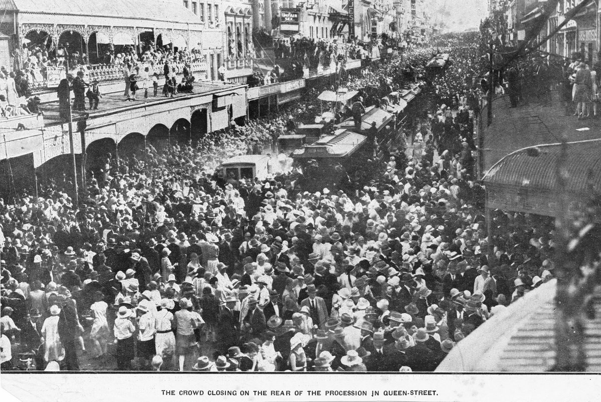 Crowd closing on the rear of the procession in Queen Street to welcome Queensland Aviator Bert Hinkler, Brisbane, 1928