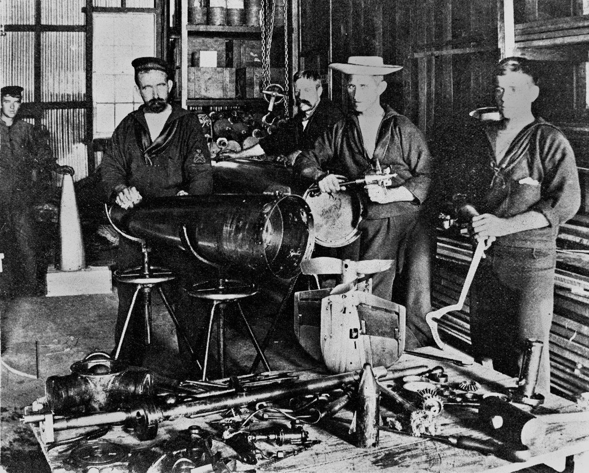 Studying the mechanism of a Whitehead torpedo at the Naval Stores in Brisbane, Queensland 1899