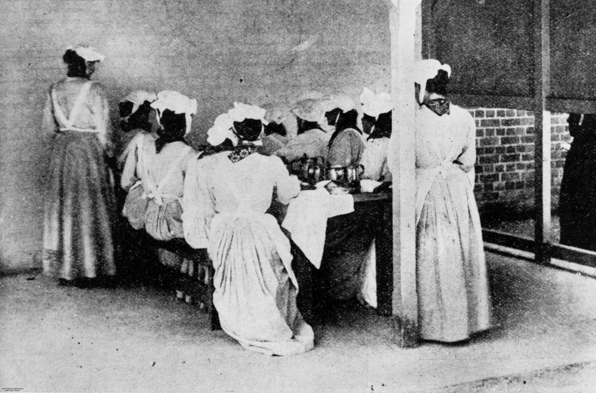Prisoners having dinner in the exercise yard at the new female division of Boggo Road Gaol, Brisbane, 1903