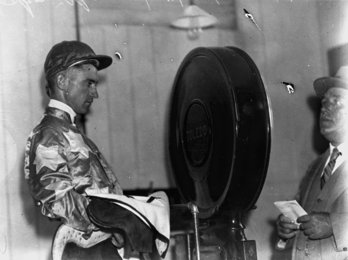 Jockey Tom Spencer weighing in at Albion Park races, Brisbane, January 1934