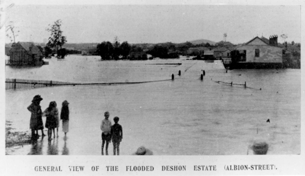 Children survey the flooded Deshon Estate in Buranda, Brisbane, 1905