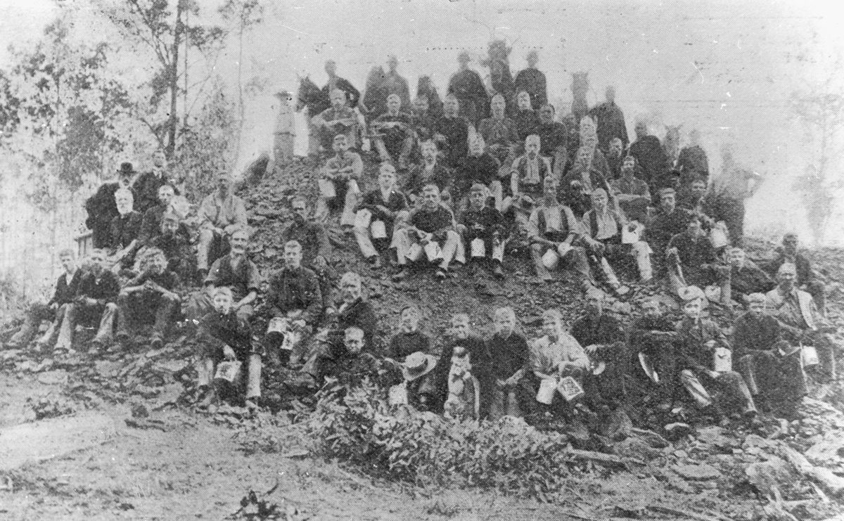 Workers posing on a hill at the Rhondda Colliery, Ipswich, 1905