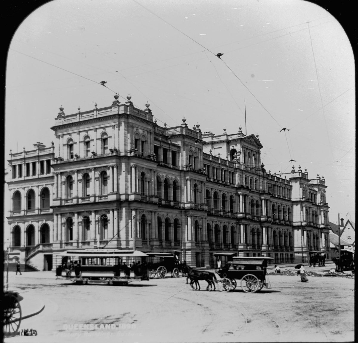 Traffic passing the Treasury Building, Brisbane, 1898