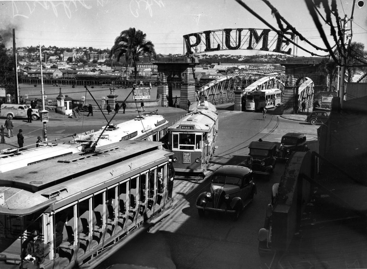 Electric trams travelling along Queen Street from the Victoria Bridge, Brisbane, 1939