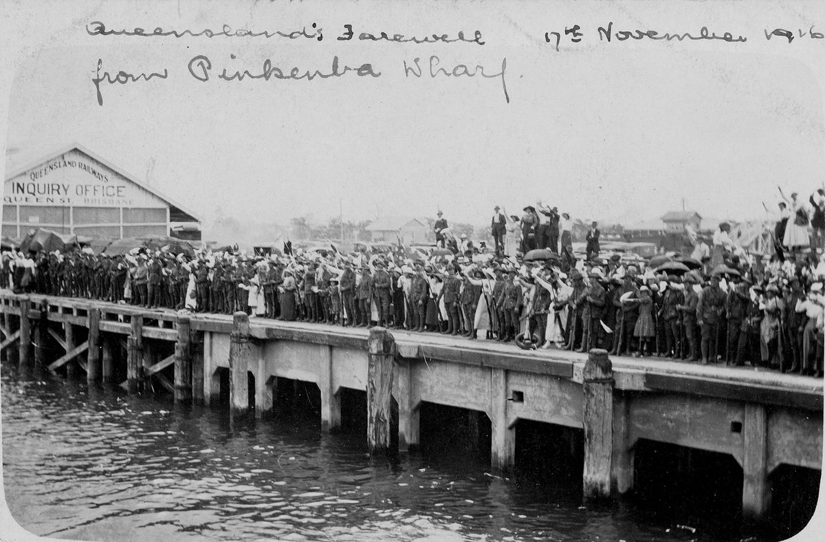 Crowd bidding farewell in the rain on Pinkenba Wharf, Brisbane