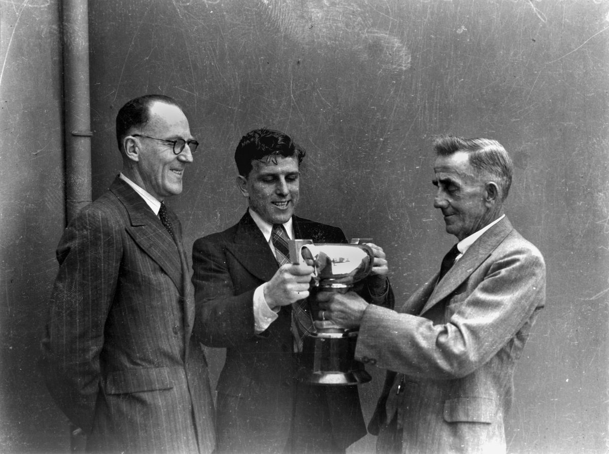 Jack Kellaway is presented with a Rugby League cup in October 1944
