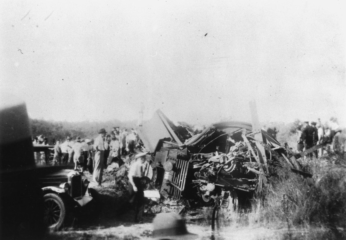 People gathered at the wreckage of the derailed train at Camp Mountain, 1947