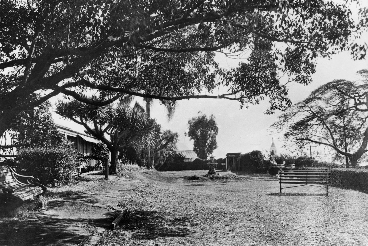 View of the front garden and house of Montpelier at Bowen Hills, 1927