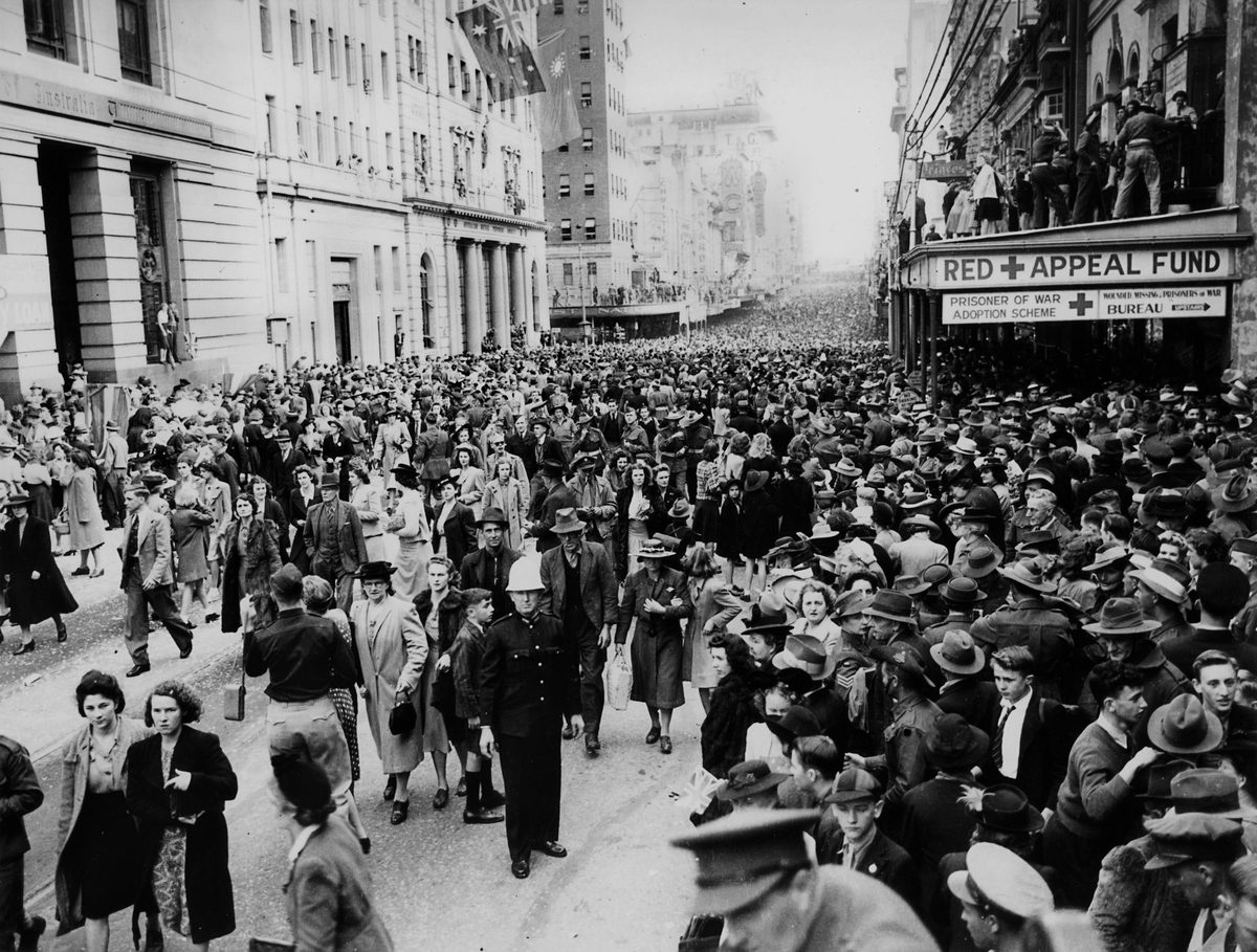 Crowds in the street after the march of the Seventh Division troops through Brisbane, 1944