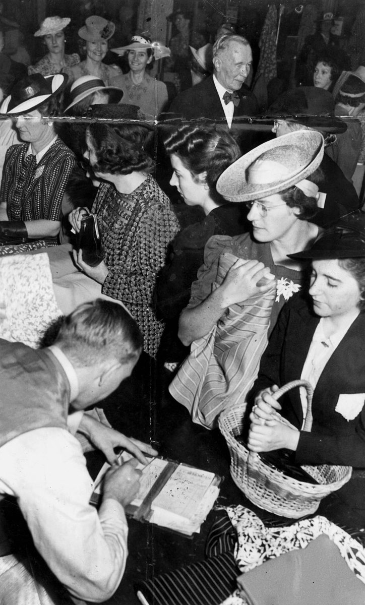Shoppers purchasing rationed goods in T.C. Beirne's store in Brisbane during World War II