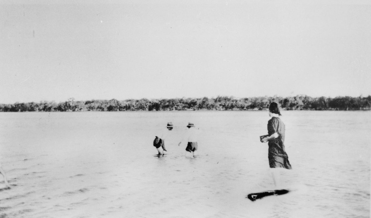 Playing in the shallows at Cribb Island, 1928