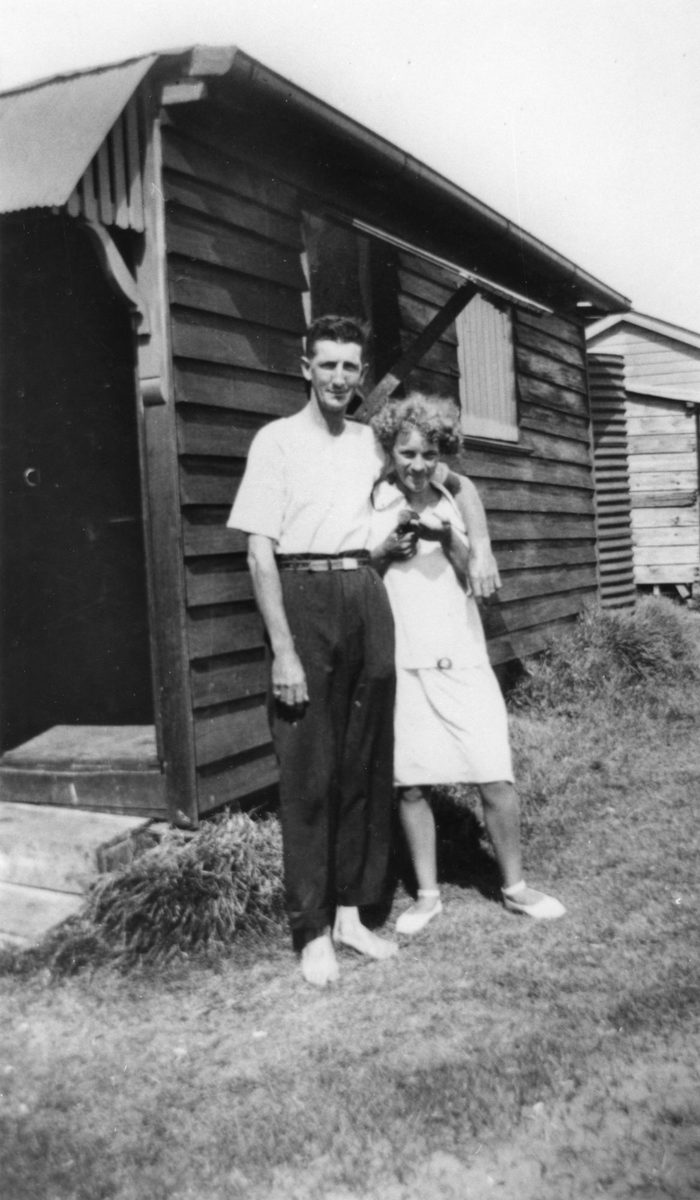 Young couple pictured outside a beach house at Cribb Island, Christmas 1928