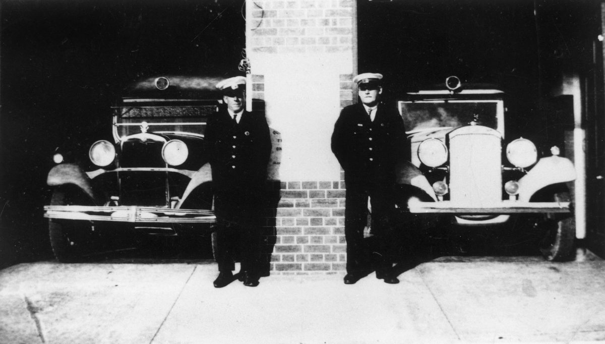 Ambulance officers standing outside the ambulance station, Wynnum, 1926