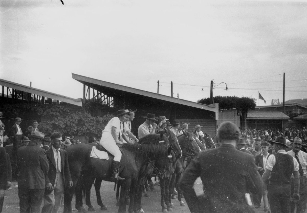 Mounted horsemen amongst the crowd at the Exhibition, Brisbane, 1948