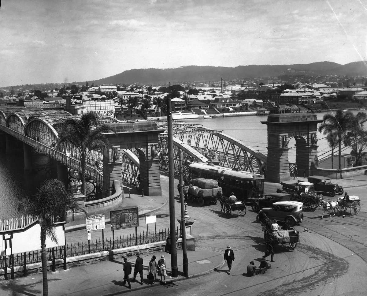Cars, trams and horsedrawn carriages travelling on the second permanent Victoria Bridge, Brisbane, 1926