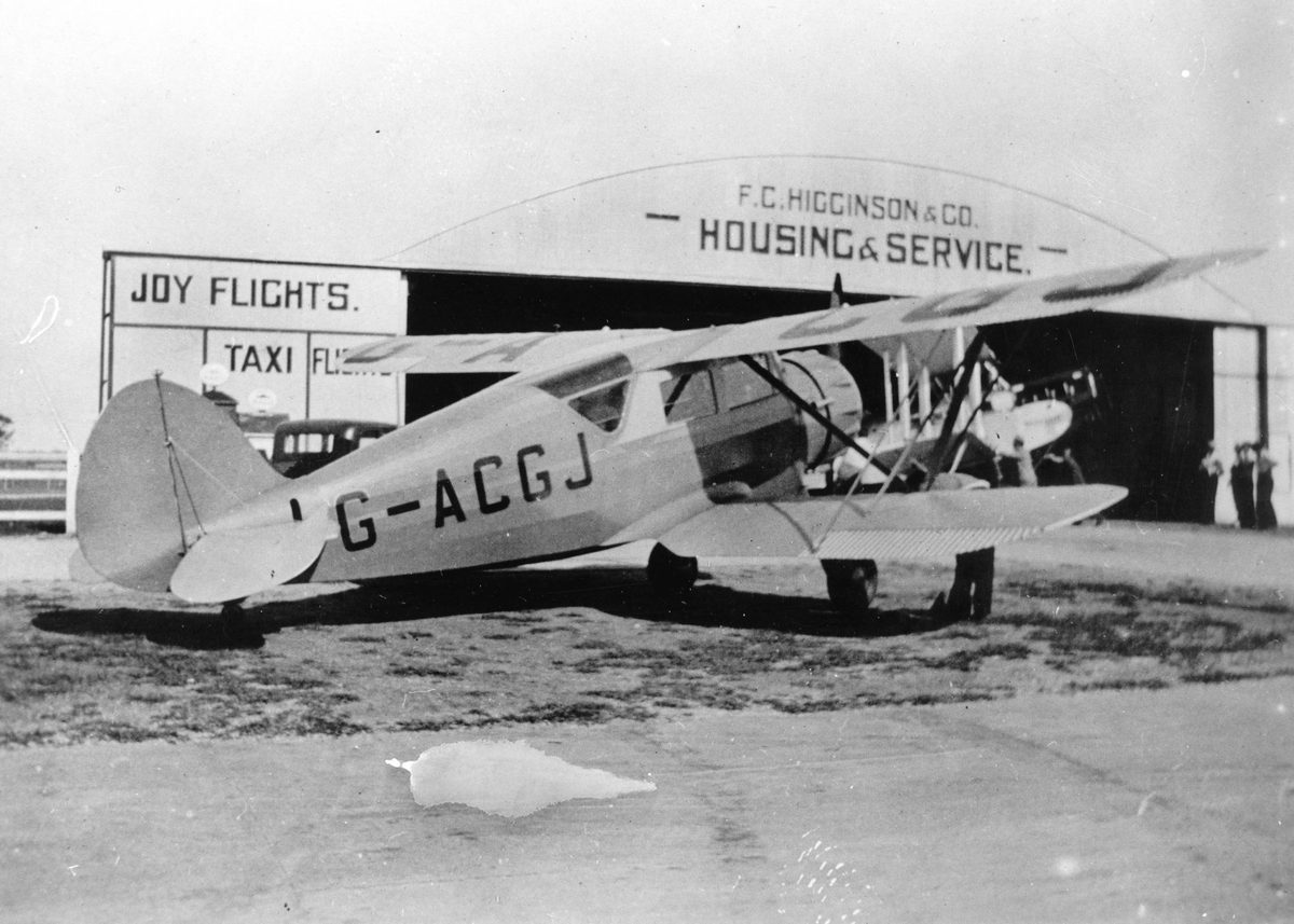Waco UIC biplane in front of an aircraft hangar at Archerfield, 1935