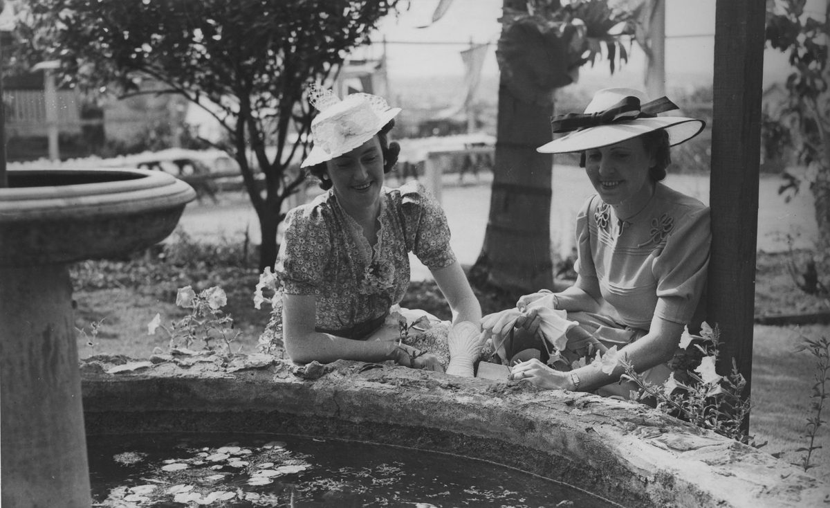 Two women beside a fountain, Brisbane, 1939
