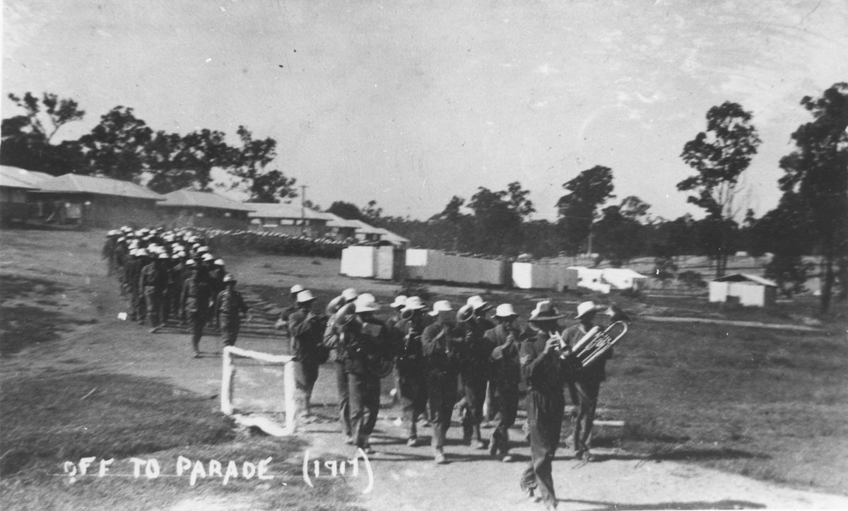 Troops marching behind a brass band, Enoggera Camp, Brisbane, 1917