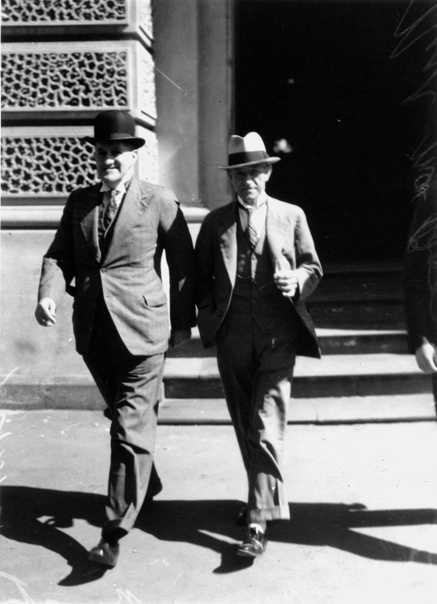 Two smartly attired gentlemen stepping out in Brisbane, 1938