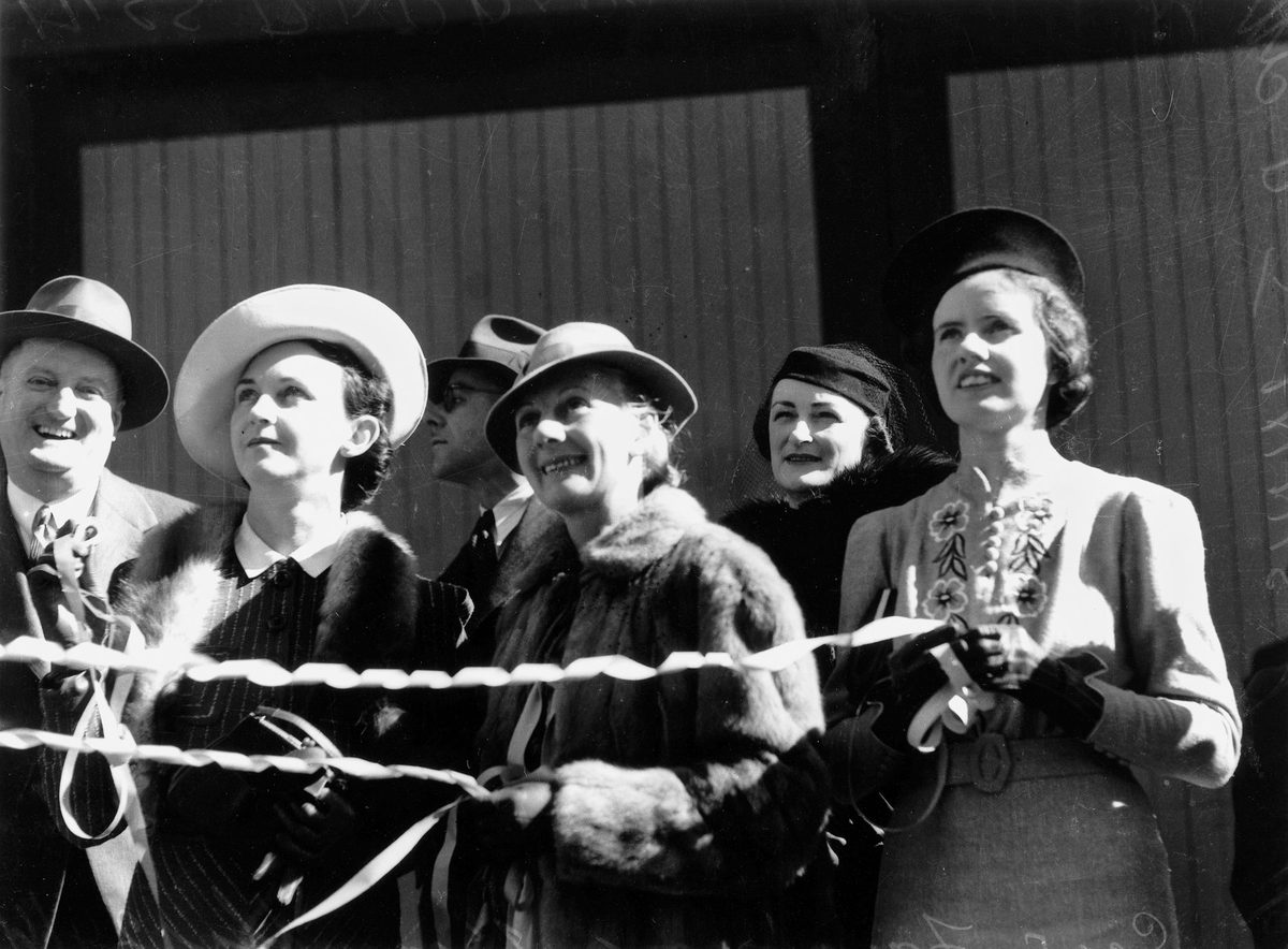 Miss Barbara Midson and Mrs P. J. Innis farewell the Gow family on board the Kanimbla, 1939
