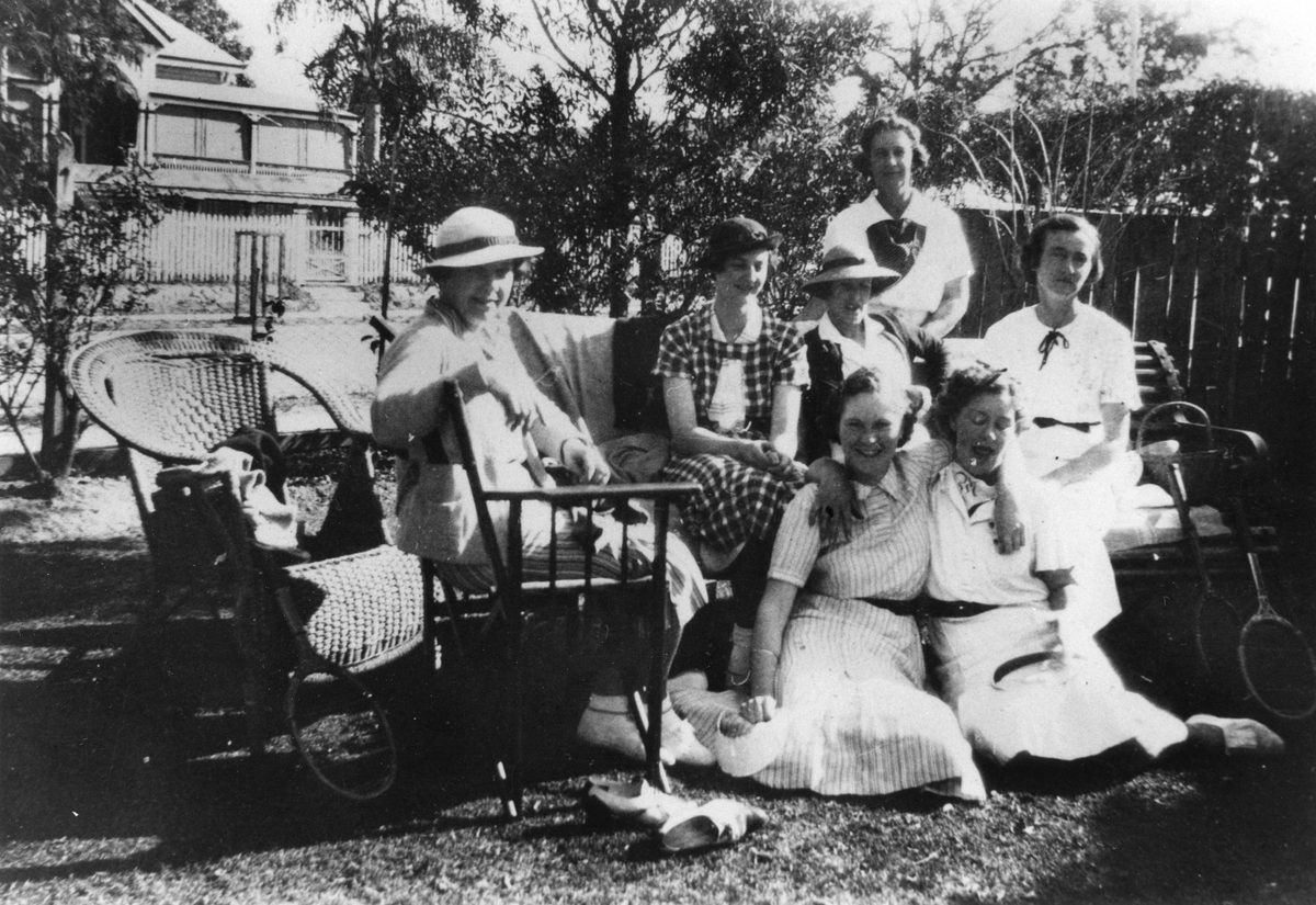 Group of ladies seated in the garden after an afternoon of tennis, Clayfield, 1936