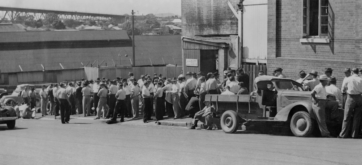 Wharf labourers waiting to apply for jobs, November 1949