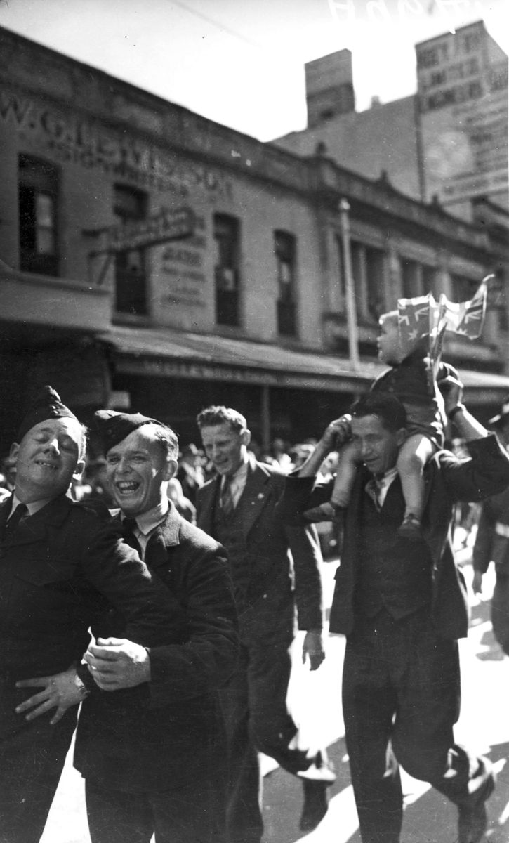 Soldiers enjoy participating in the VJ Day procession, 1945