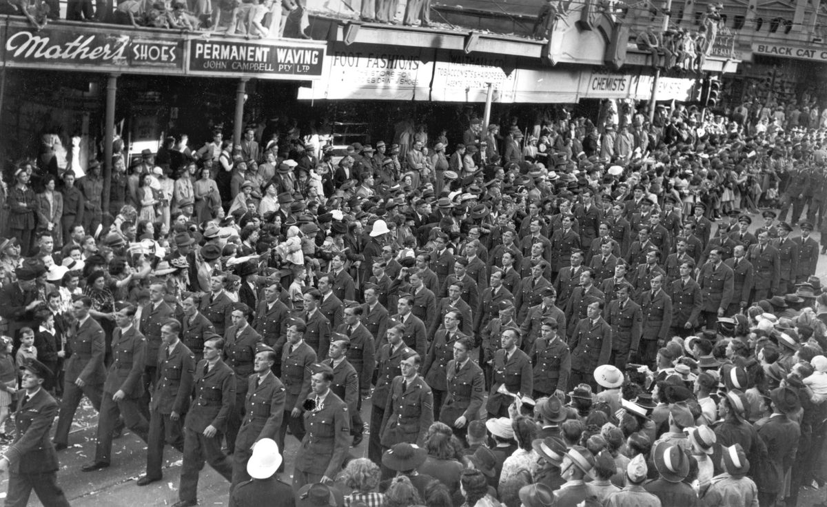 Soldiers march by the crowd on VJ Day in Brisbane, 1945