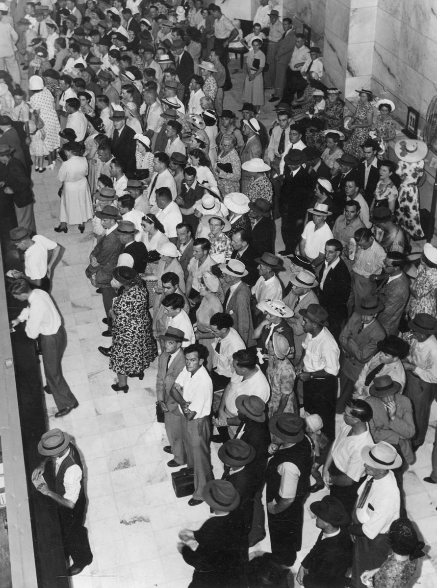 Hundreds of customers wait for service at the Commonwealth Bank, Brisbane, 1949