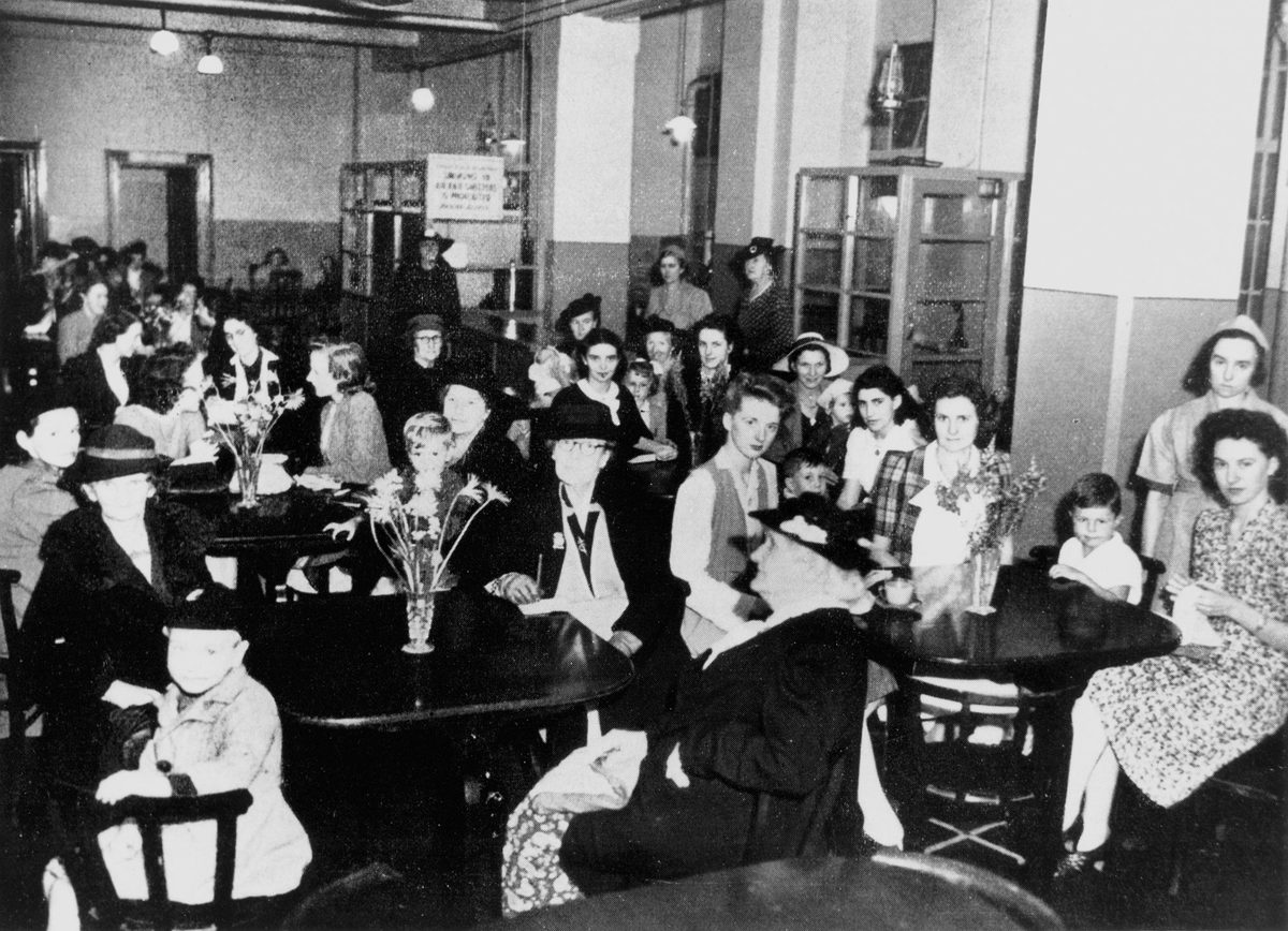 Women and children enjoying a break in the Women's Rest Room, City Hall Brisbane, 1942