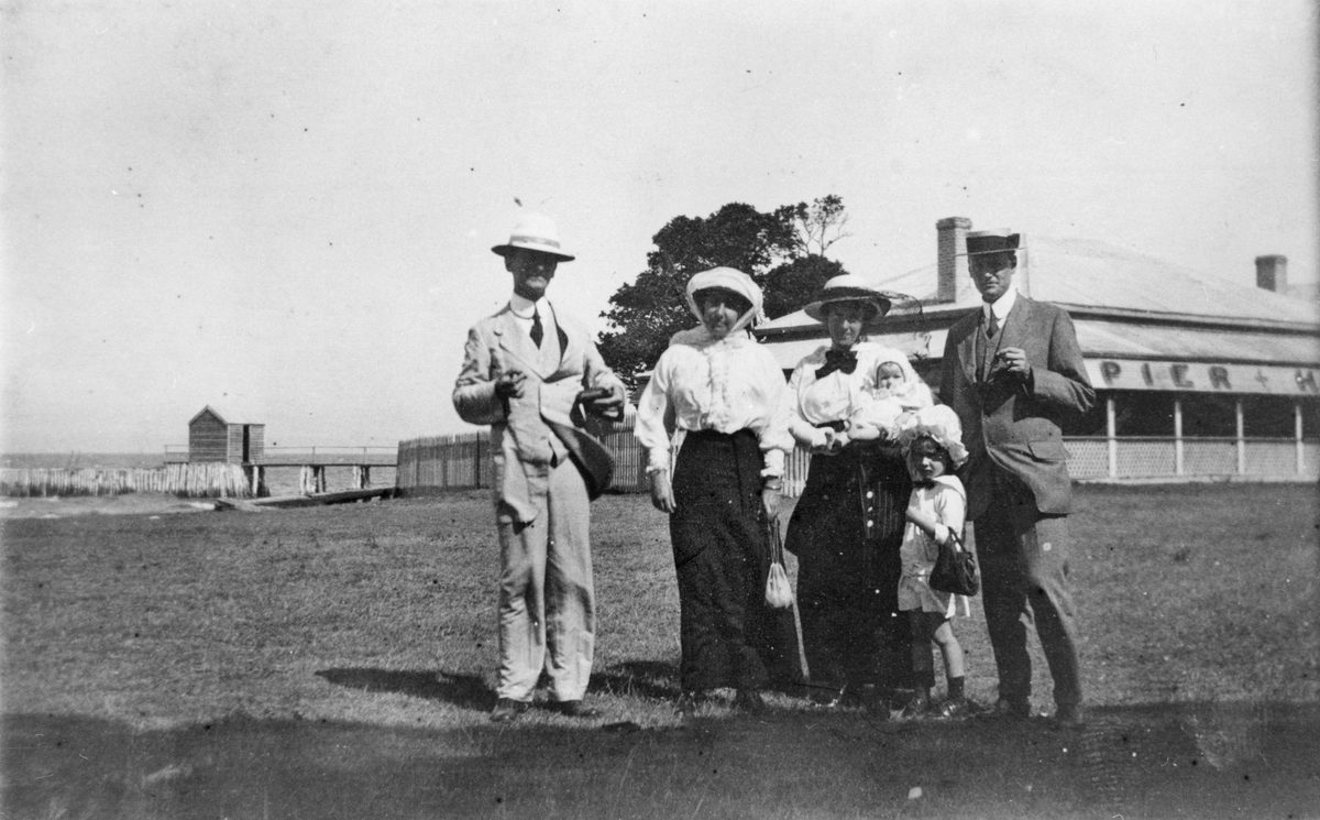 Group of people standing outside the Pier Hotel, Cleveland, 1914
