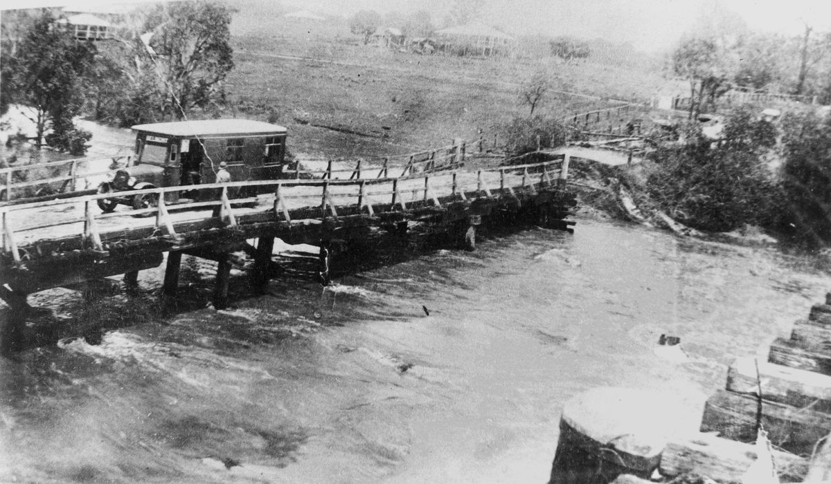 Bus stranded on Old Cleveland Road bridge, Bulimba Creek at Belmont, Brisbane in 1931