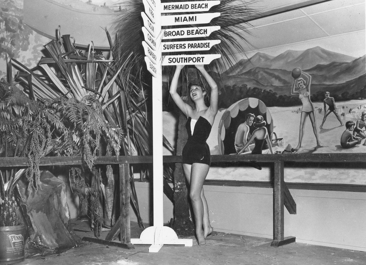 Young lady posing as part of a tourist exhibition, 1954